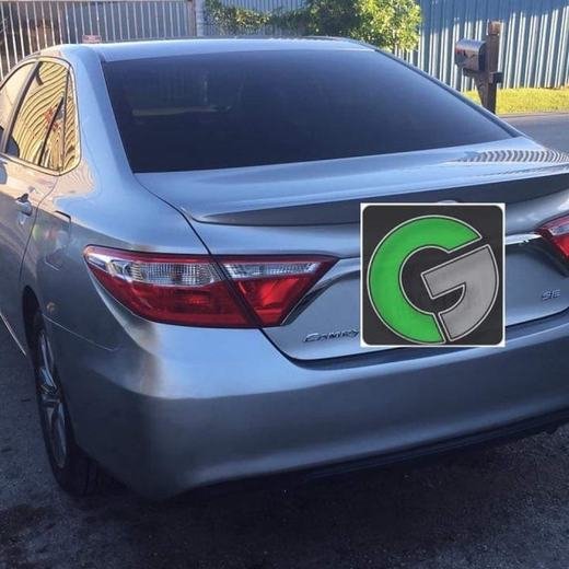 The same silver sedan after the rear quarter panel repair