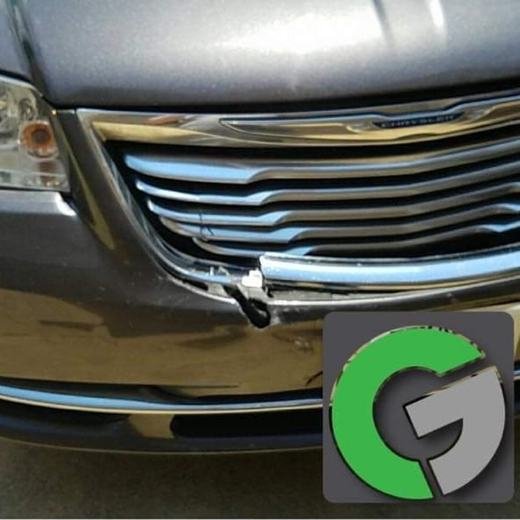 Gray minivan with a damaged front bumper and grille